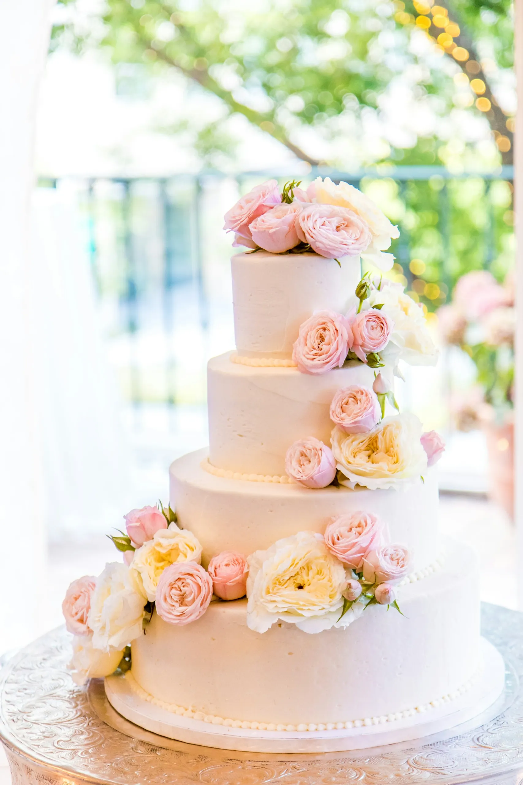 Elegant tiered wedding cake with sugar flowers